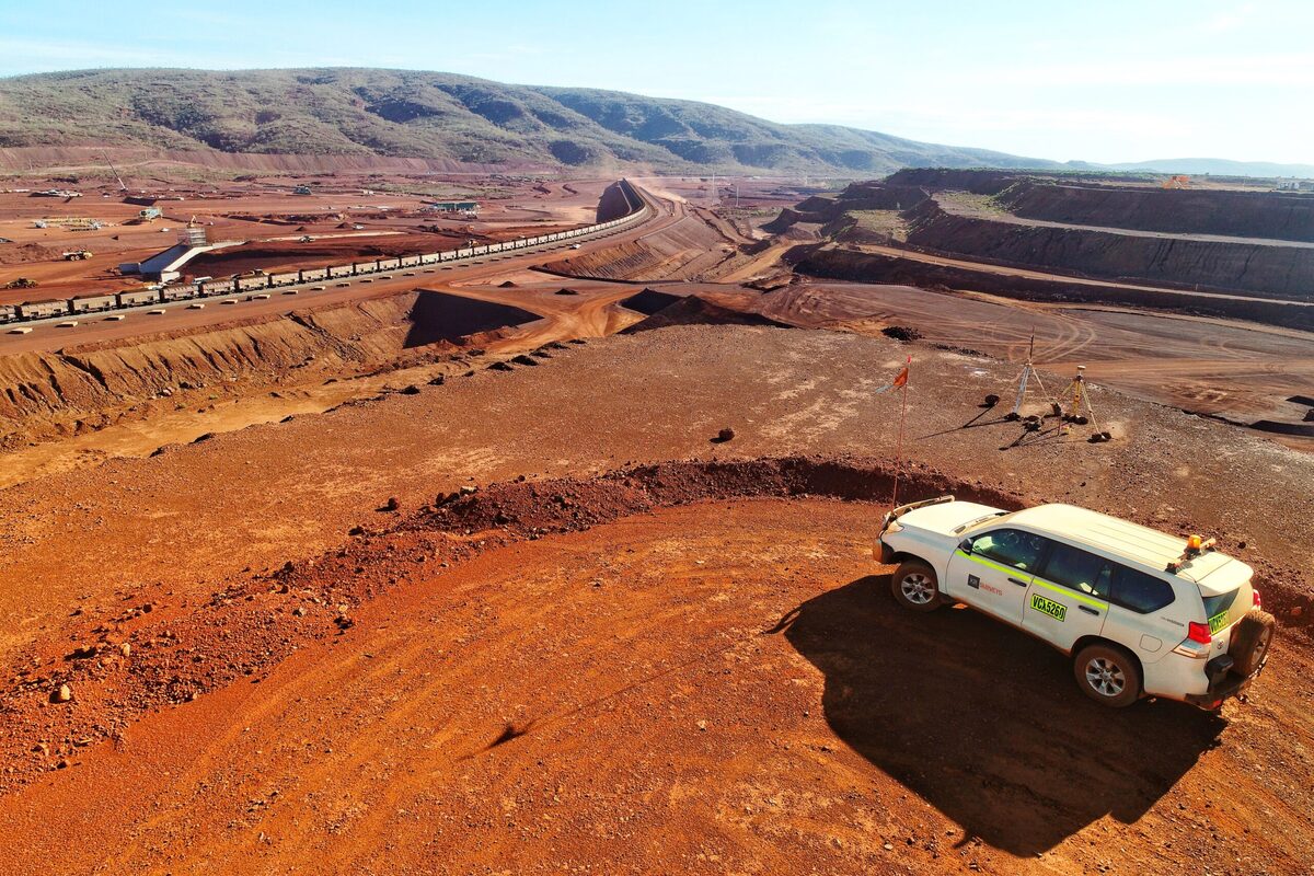 A KR Surveys four-wheel drive parked above a mine site in Western Australia, with survey equipment set up behind it