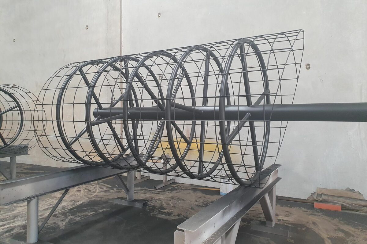 Curved steel mesh cages from Roseworx Engineering's work on The Old Synagogue in Fremantle, resting on steel stands