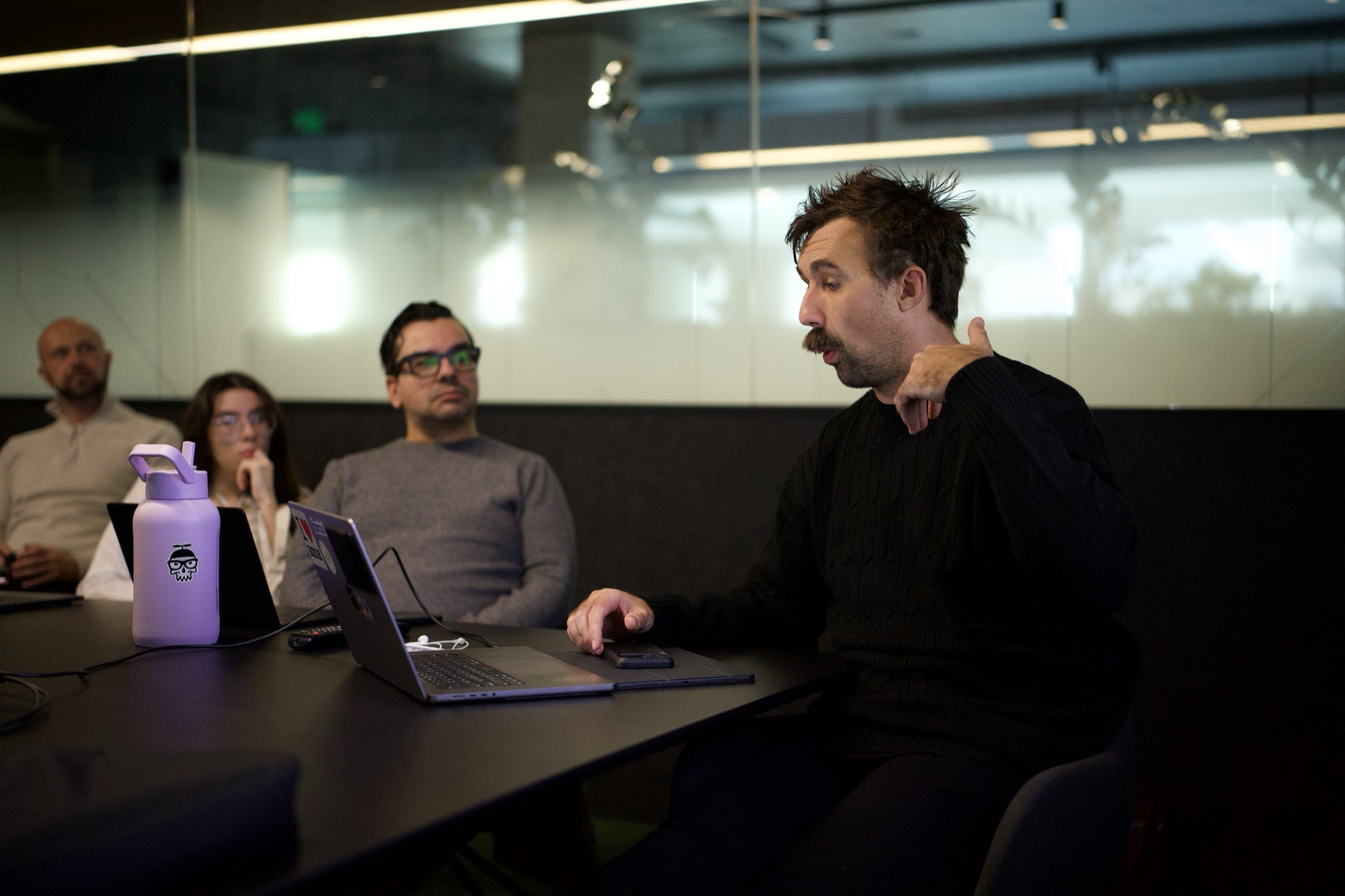 A Scalify consultant talking a team through their AI plan in a boardroom