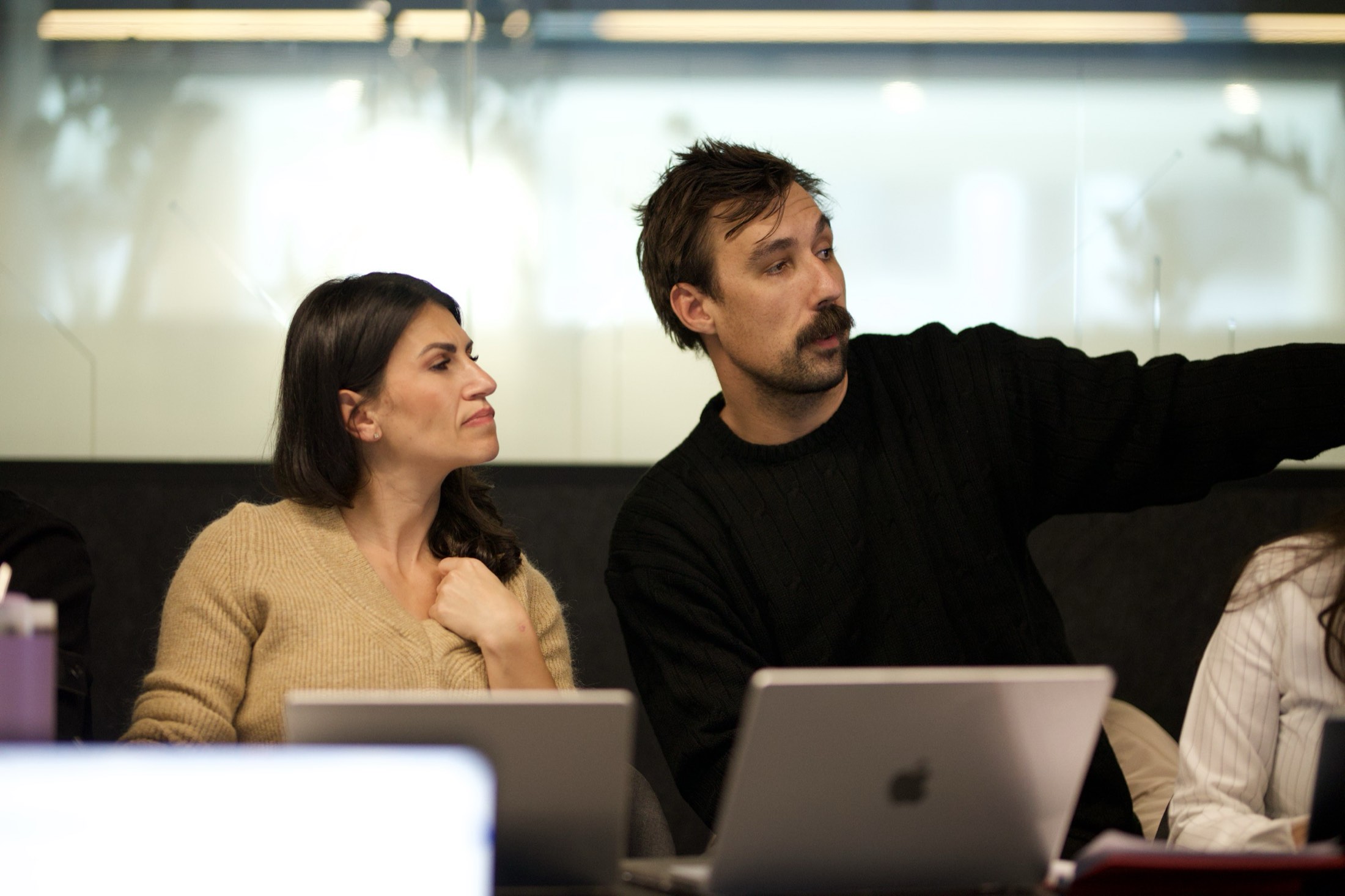 A Scalify AI consultant advising a Perth business owner at her laptop