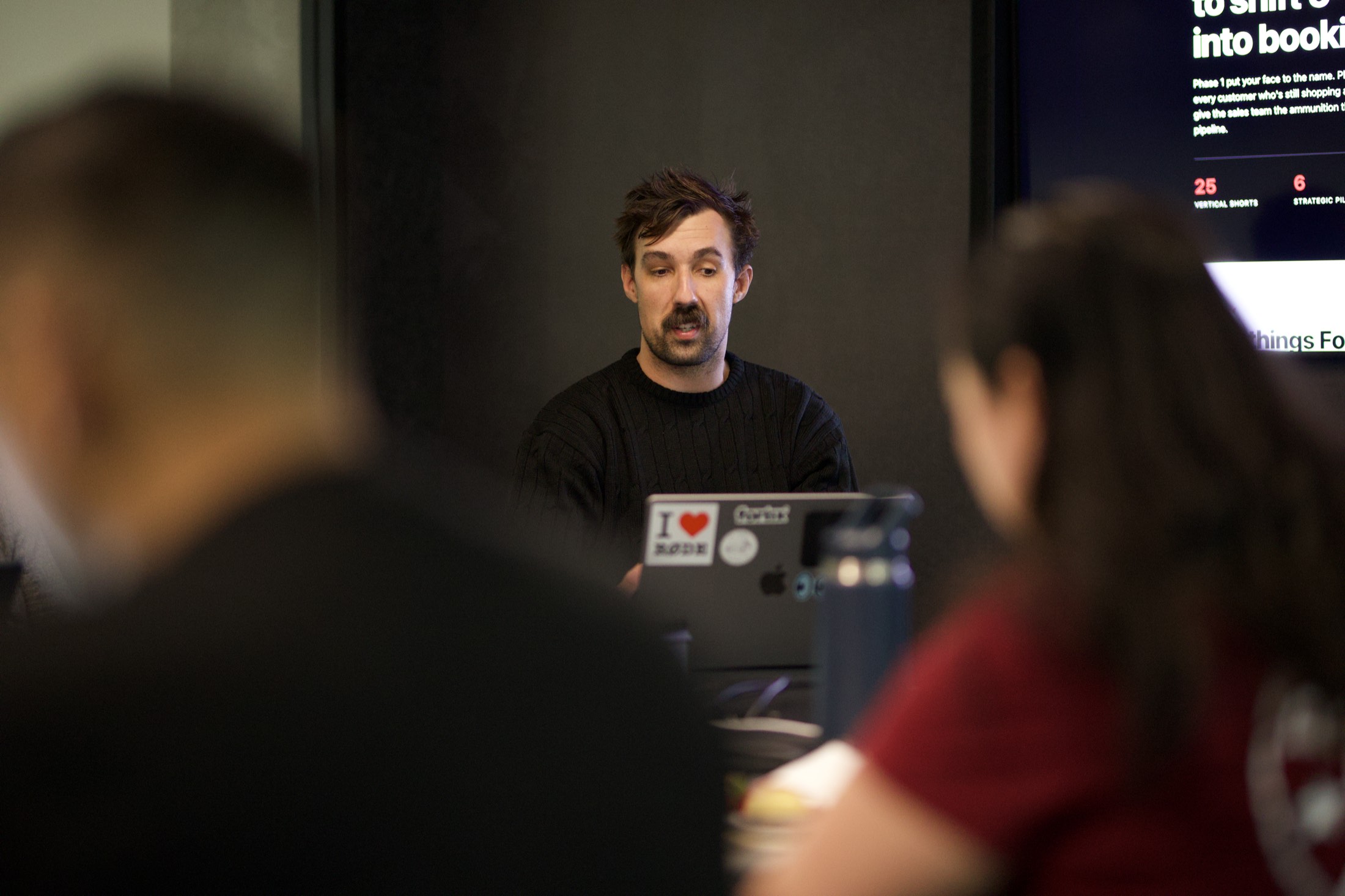 A Scalify trainer demonstrating OpenClaw from his laptop while attendees follow along on the screen behind him