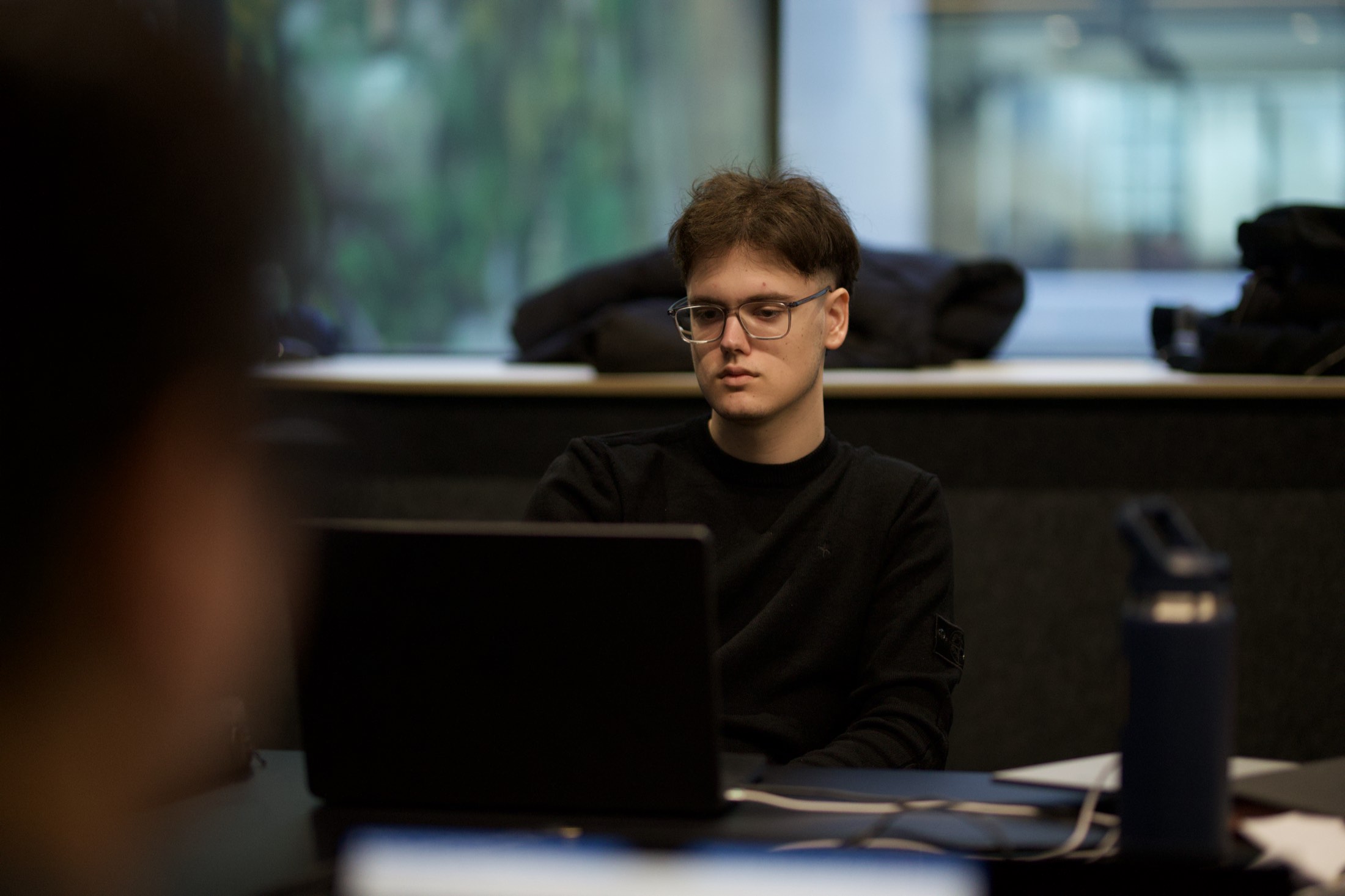 An attendee concentrating on his laptop during Scalify Power BI training in a Perth office